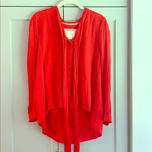 Red high low blouse with tie